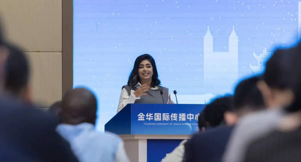 Zahra speaking at a cultural communication event